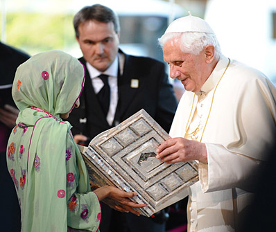 Pope Benedict receiving the Holy Koran